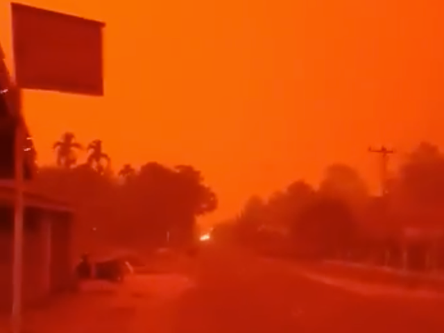 Red skies over Indonesia due to fires destroying rainforest