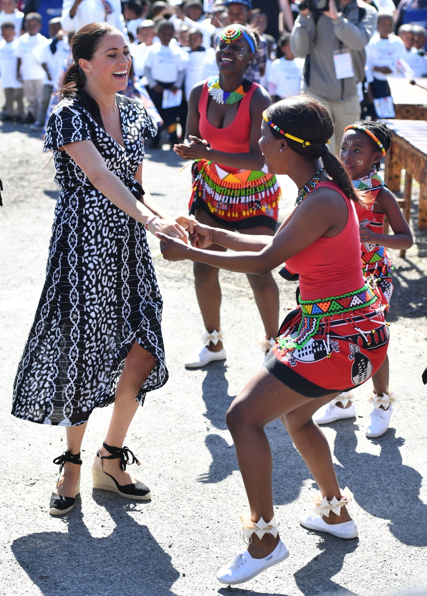 Meghan was photographed dancing with locals at the Nyanga Township in Cape Town