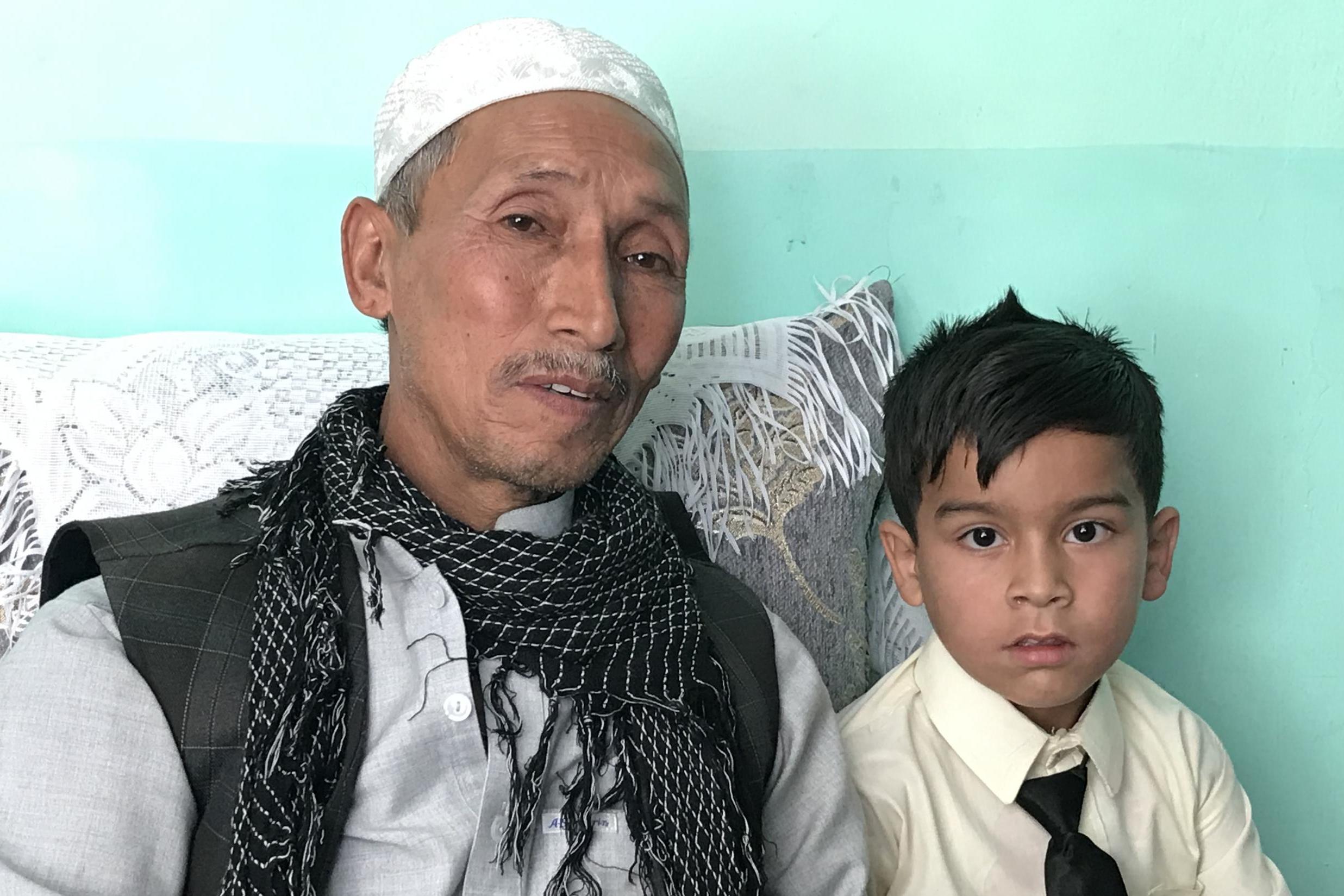 Family tragedy: Abdul Latif, left, lost his son and Samir, 6, his father in a Kabul bomb blast that killed 63 people