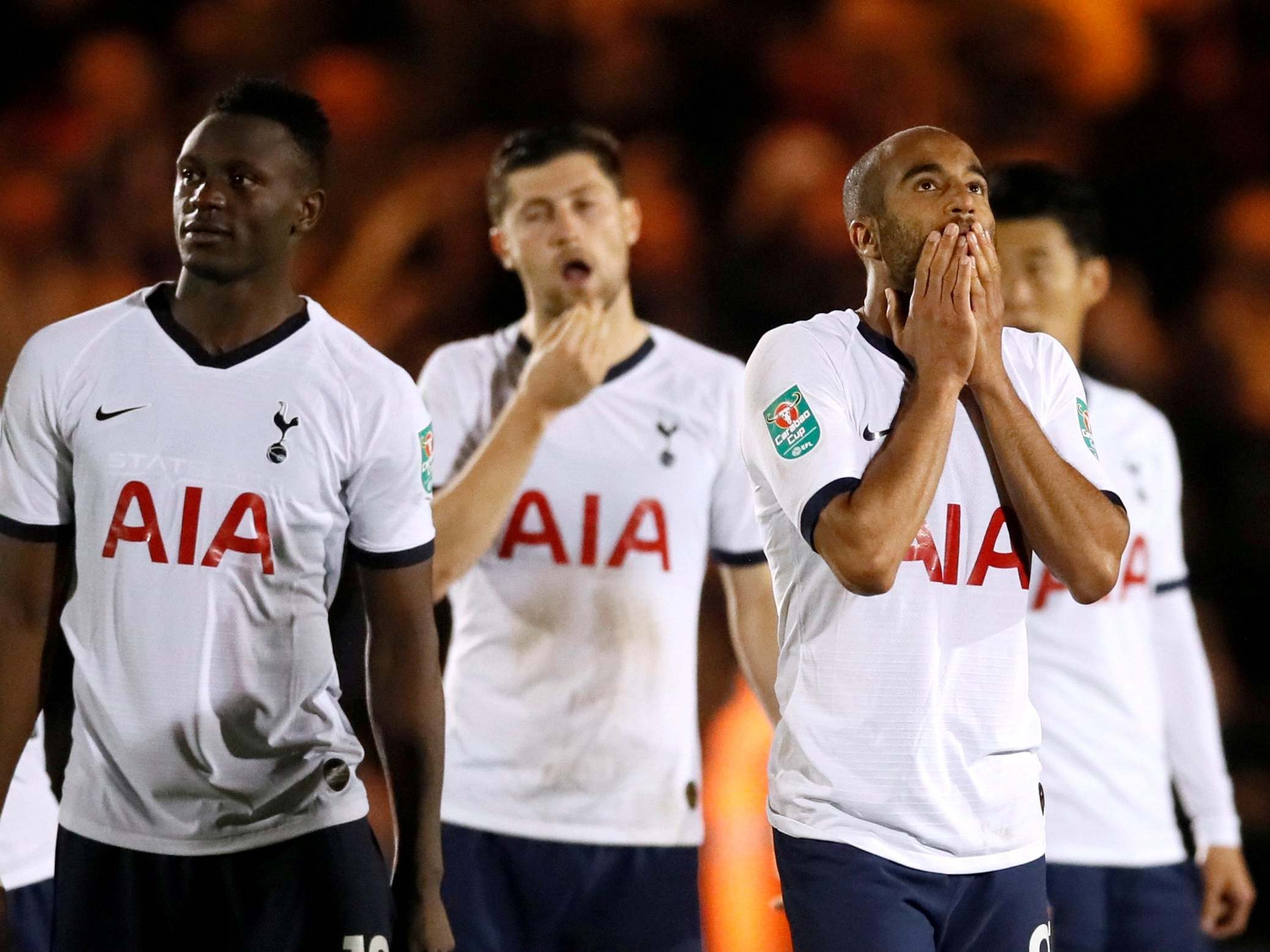 Tottenham players react after their shootout defeat