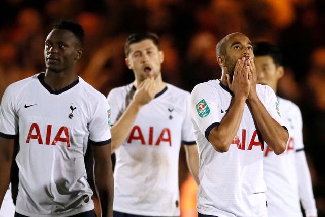 Tottenham players react after their shootout defeat