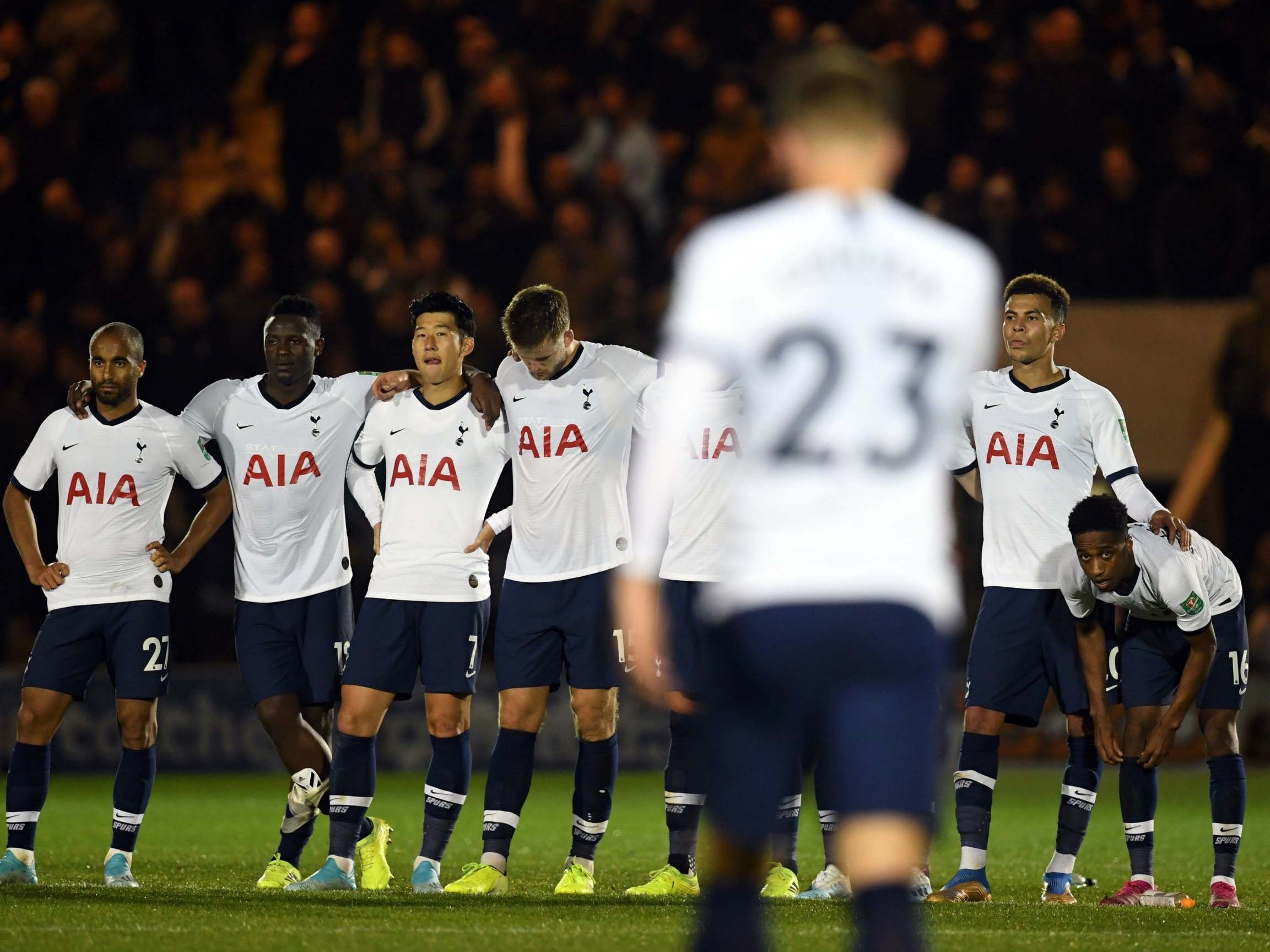 Tottenham players look on after Christian Eriksen's missed penalty