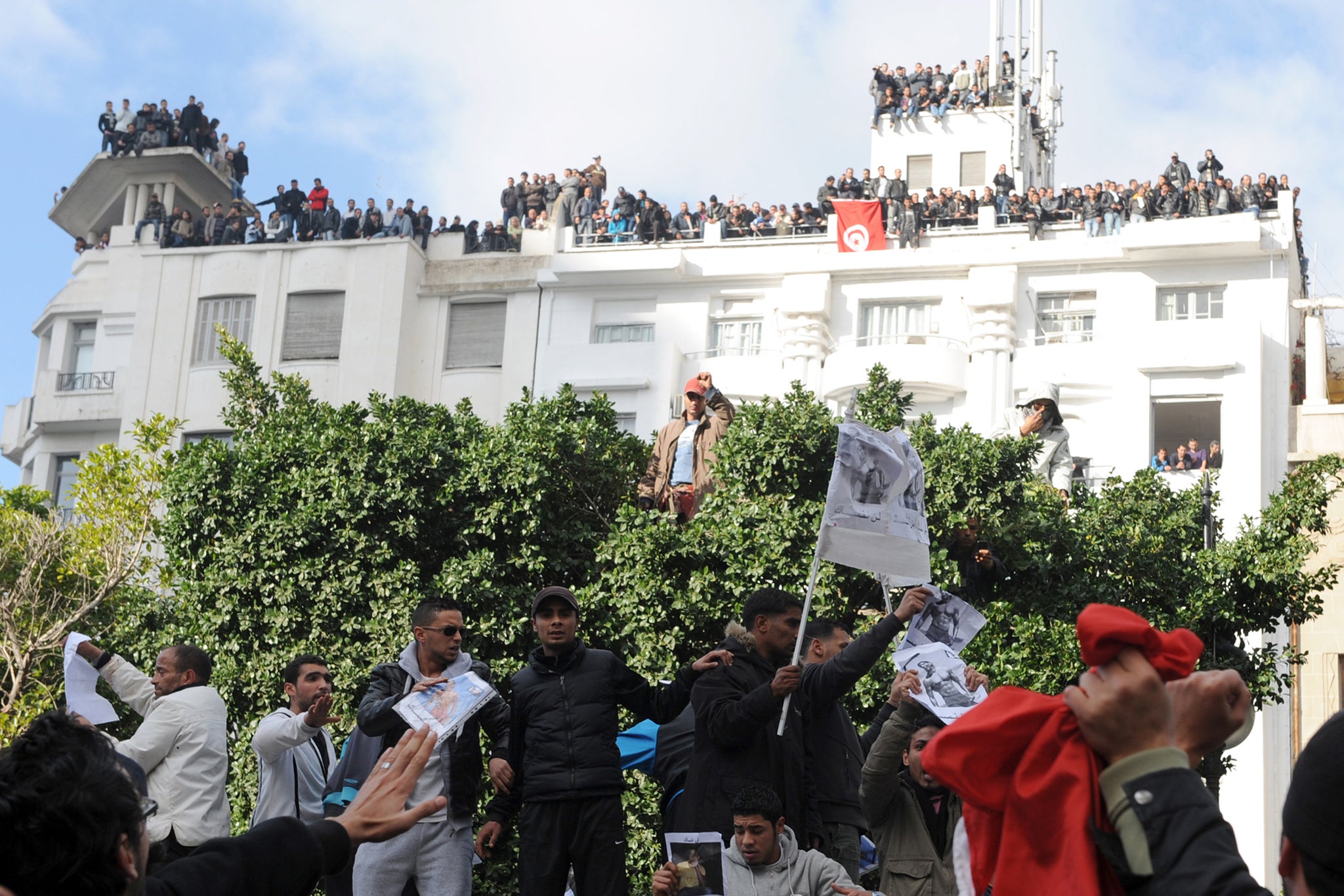 Demonstrators gather in front of the interior ministry in Tunis demanding Ben Ali resign in January 2011