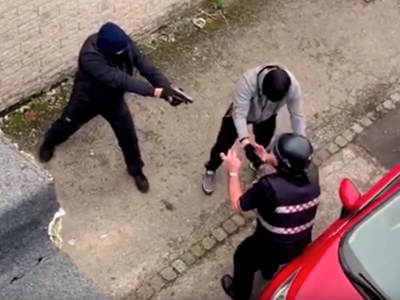 Armed robbers threaten courier with handgun in 'terrifying' raid