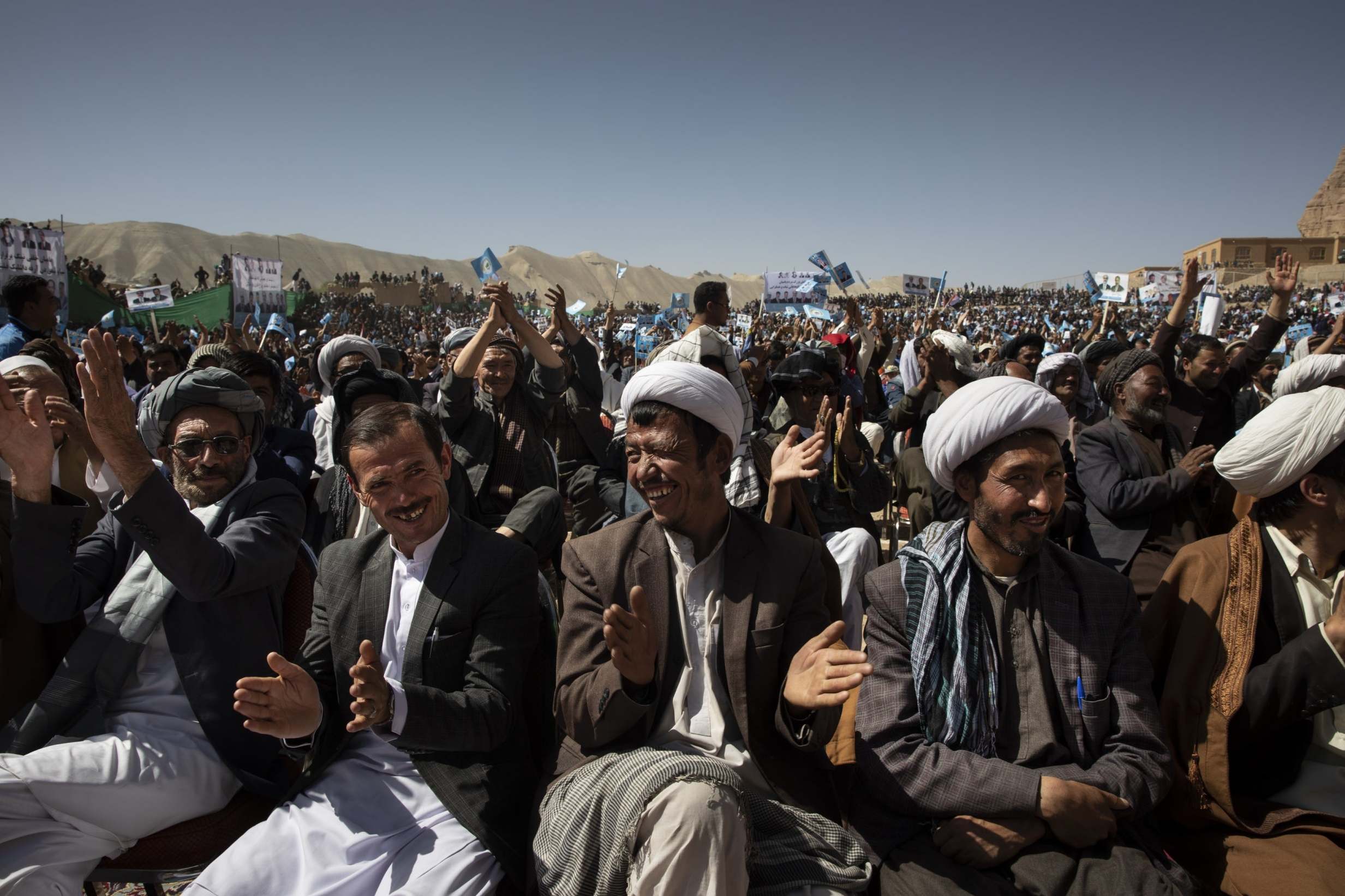 Afghan men listen to speeches during the final campaign rally (Getty)