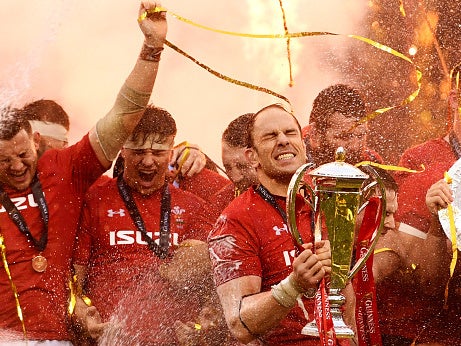 Jones lifts the Six Nations trophy after Wales completed the Grand Slam