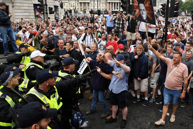 Demonstrators clash with police during a 'Free Tommy Robinson' protest on Whitehall on June 9, 2018
