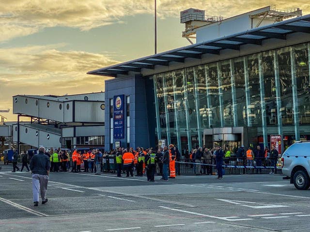 Evacuated passengers wait at the P&O ferry terminal after bomb scare