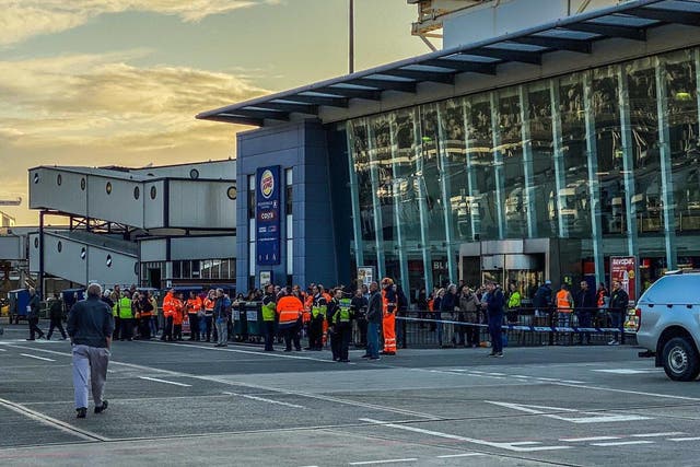 Evacuated passengers wait at the P&O ferry terminal after bomb scare