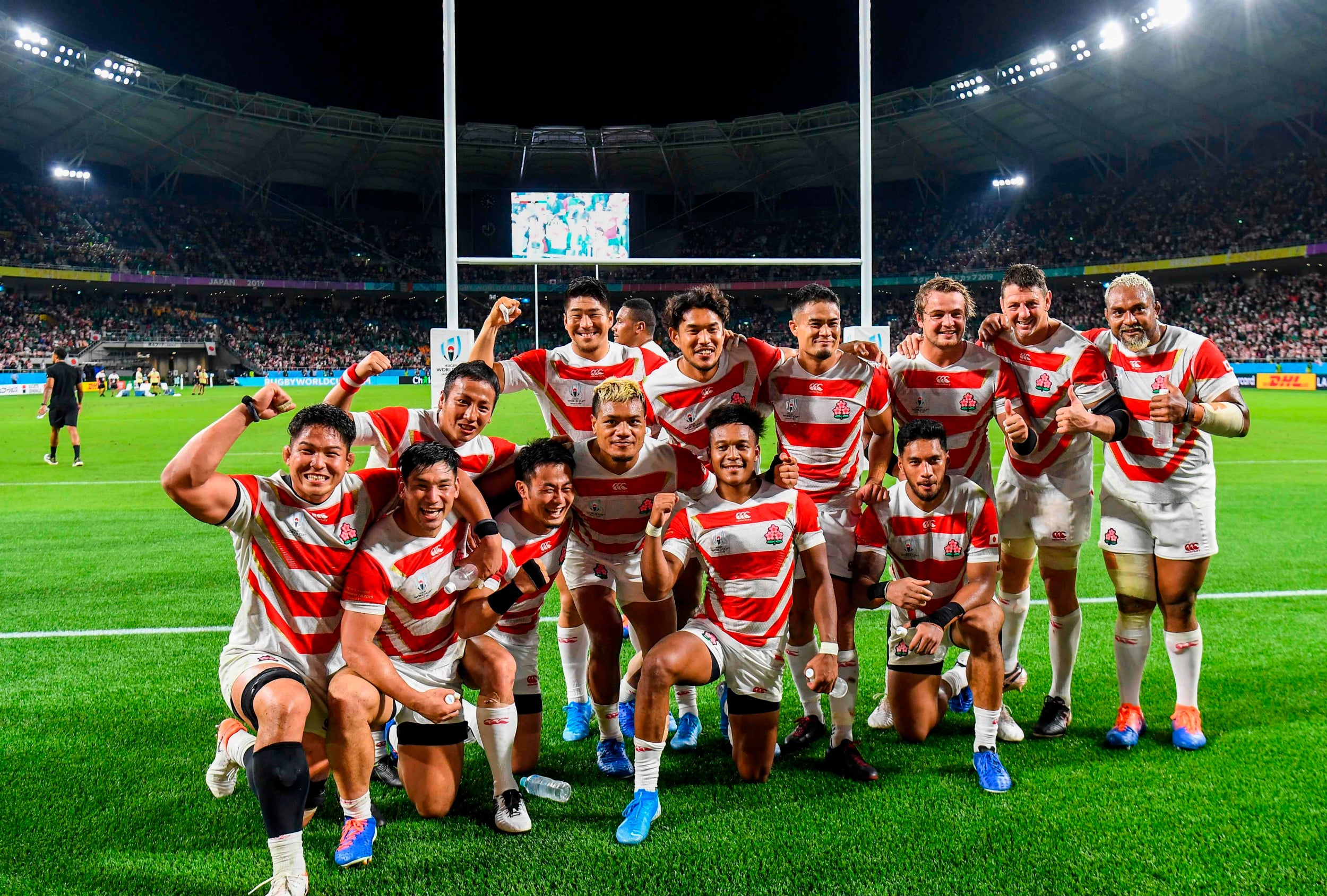 Japan celebrate defeating Ireland (AFP/Getty)