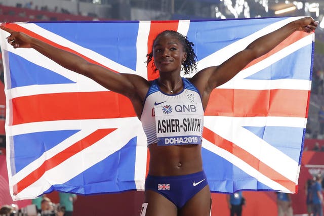 Dina Asher-Smith celebrates after setting a new personal best and British record