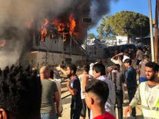 Riots break out at Greek refugee camp after two migrants die in fire