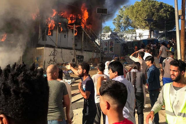 A fire broke out inside a shipping container which Greek authorities use to house refugees