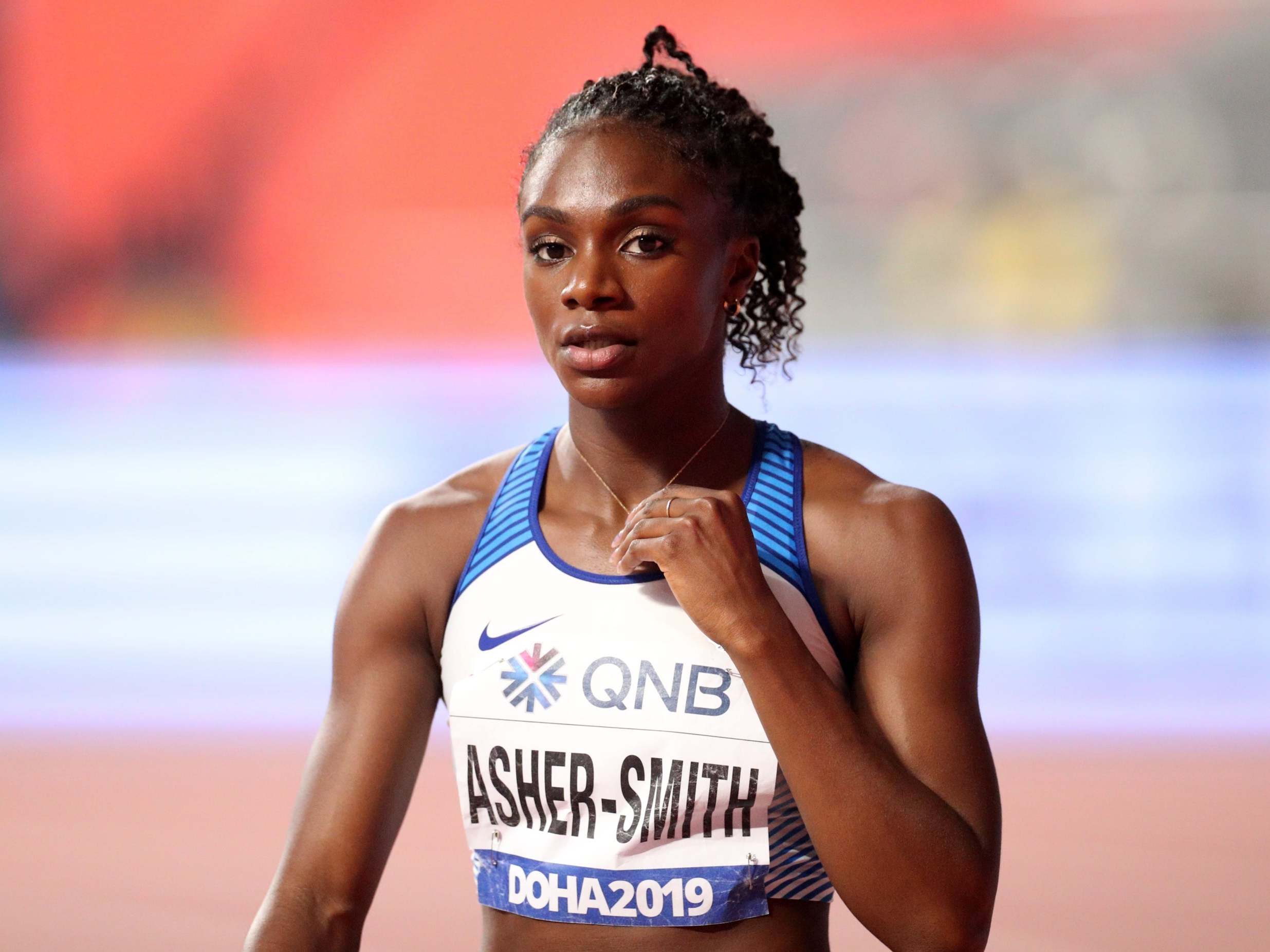 Dina Asher-Smith celebrates winning her 200m heat