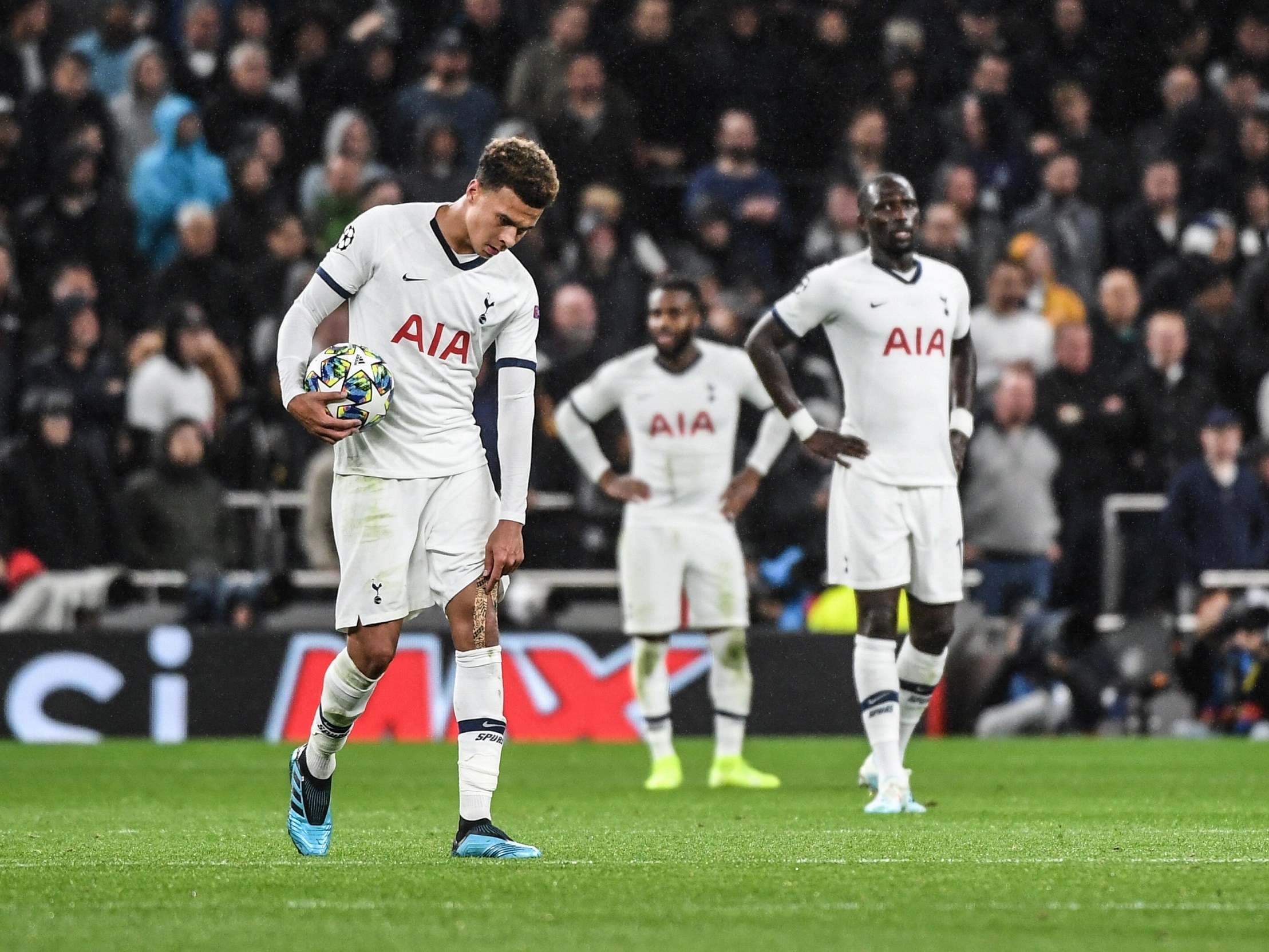 Dele Alli and the Tottenham players react after another goal conceded