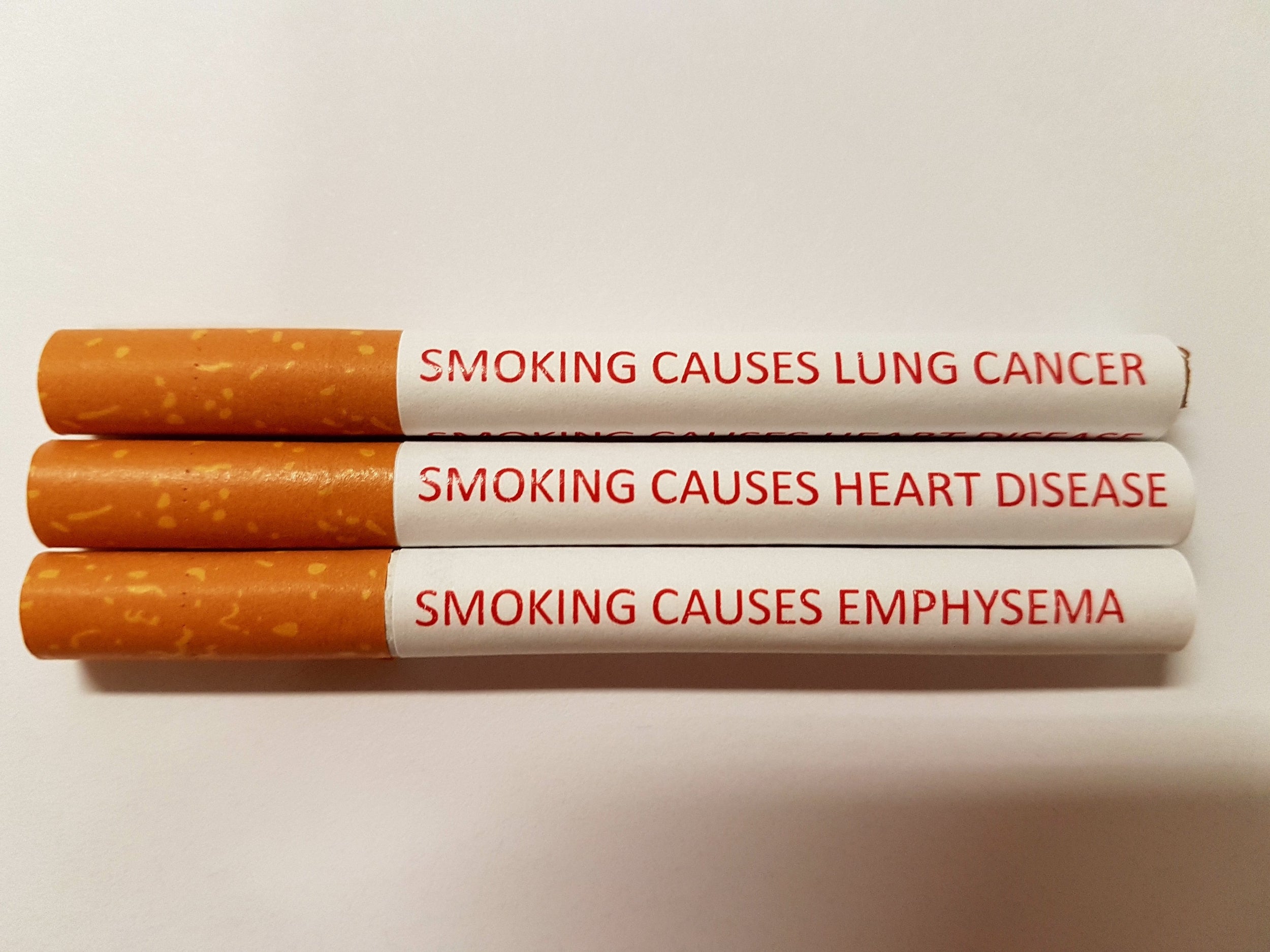 Examples of cigarettes with health warnings (EPA/James Cook University)