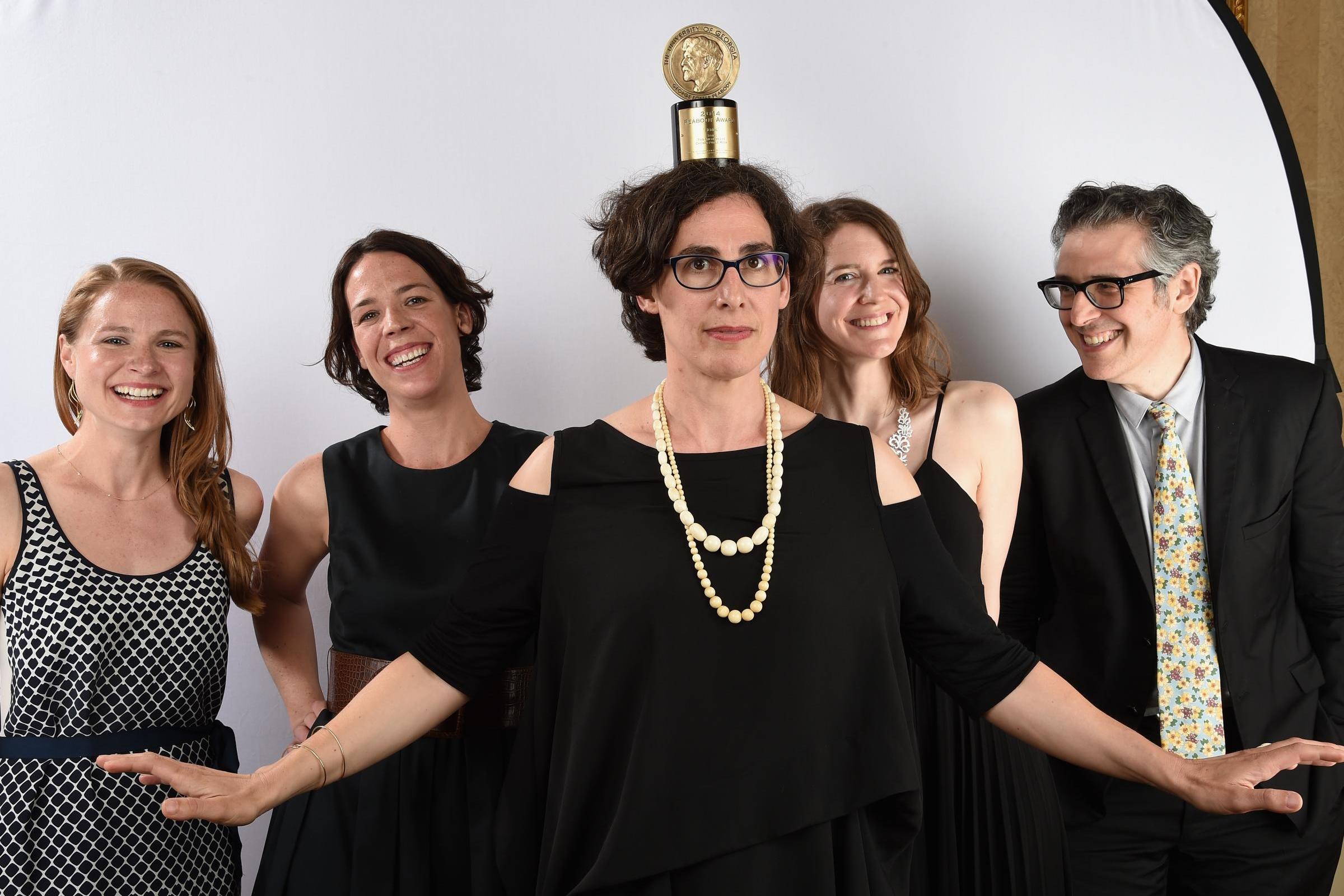 The team behind ‘Serial’, led by Sarah Koenig, with ‘This American Life’ host Ira Glass (right), and their Peabody Award​