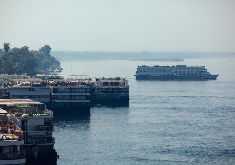 Boats dock along the Nile River shoreline in Luxor
