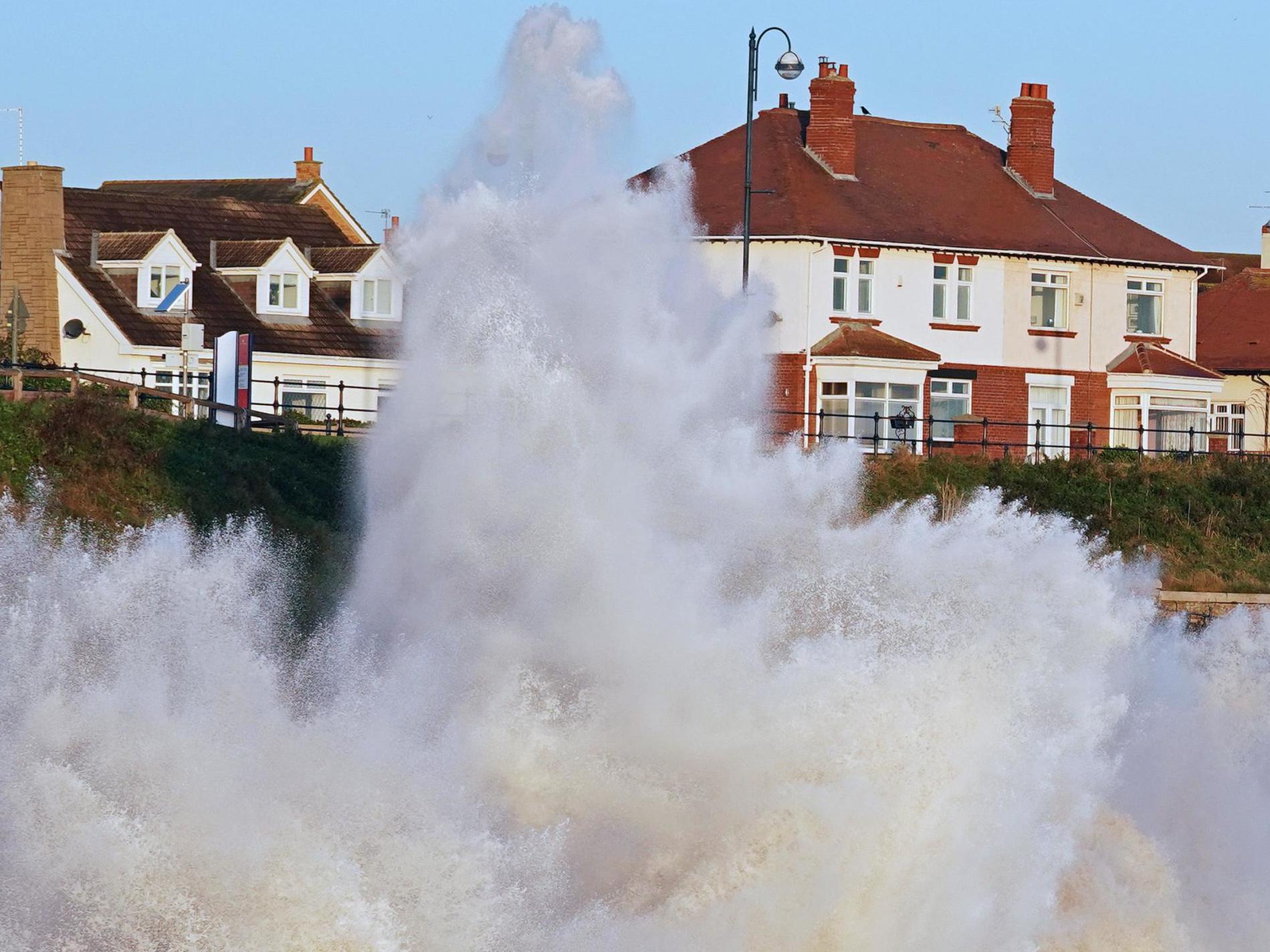 Waves crash against a County Durham sea wall on 2 October