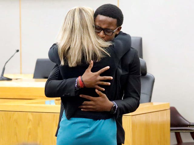 Botham Jean's younger brother Brandt Jean hugs former Dallas police officer Amber Guyger after delivering his impact statement to her following her 10-year prison sentence for murder
