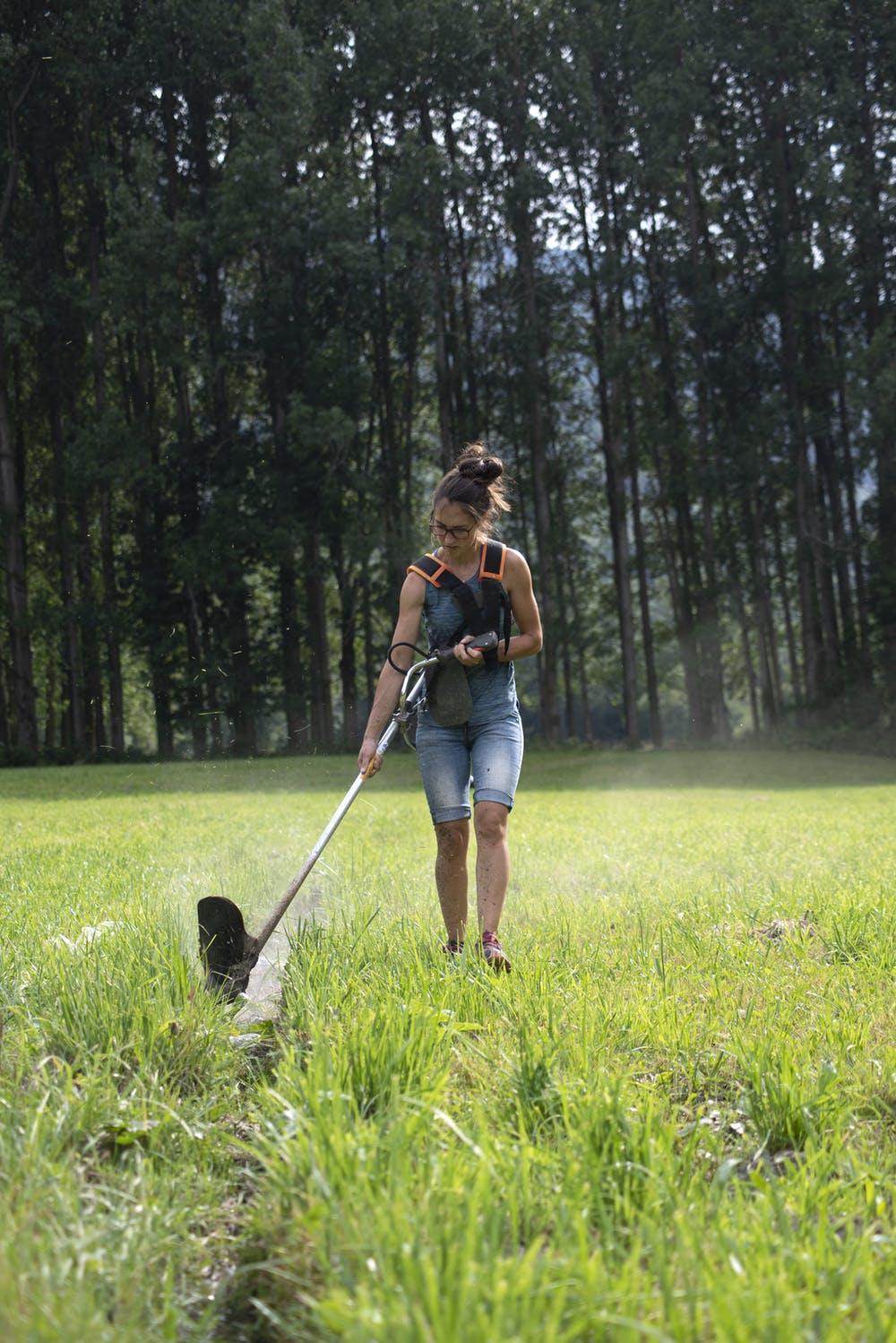 Jordina Casimiro, from Casa Sintet, prunes the soil on her land