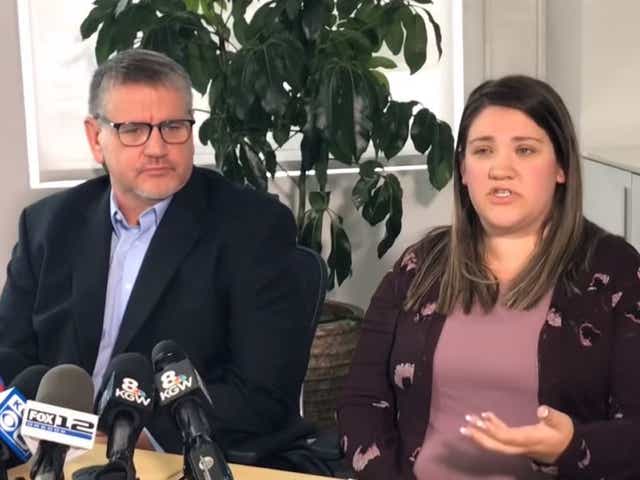 Dr Bryce Cleary (left) with Allysen Allee (right), one of at least 17 children he fathered through sperm donations. Dr Cleary is suing Oregon Health & Science University for allegedly breaking an agreement that he would only father five children.
