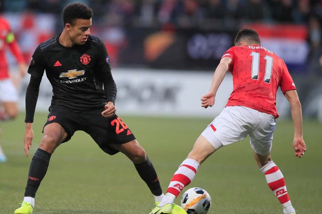 Mason Greenwood challenges for the ball