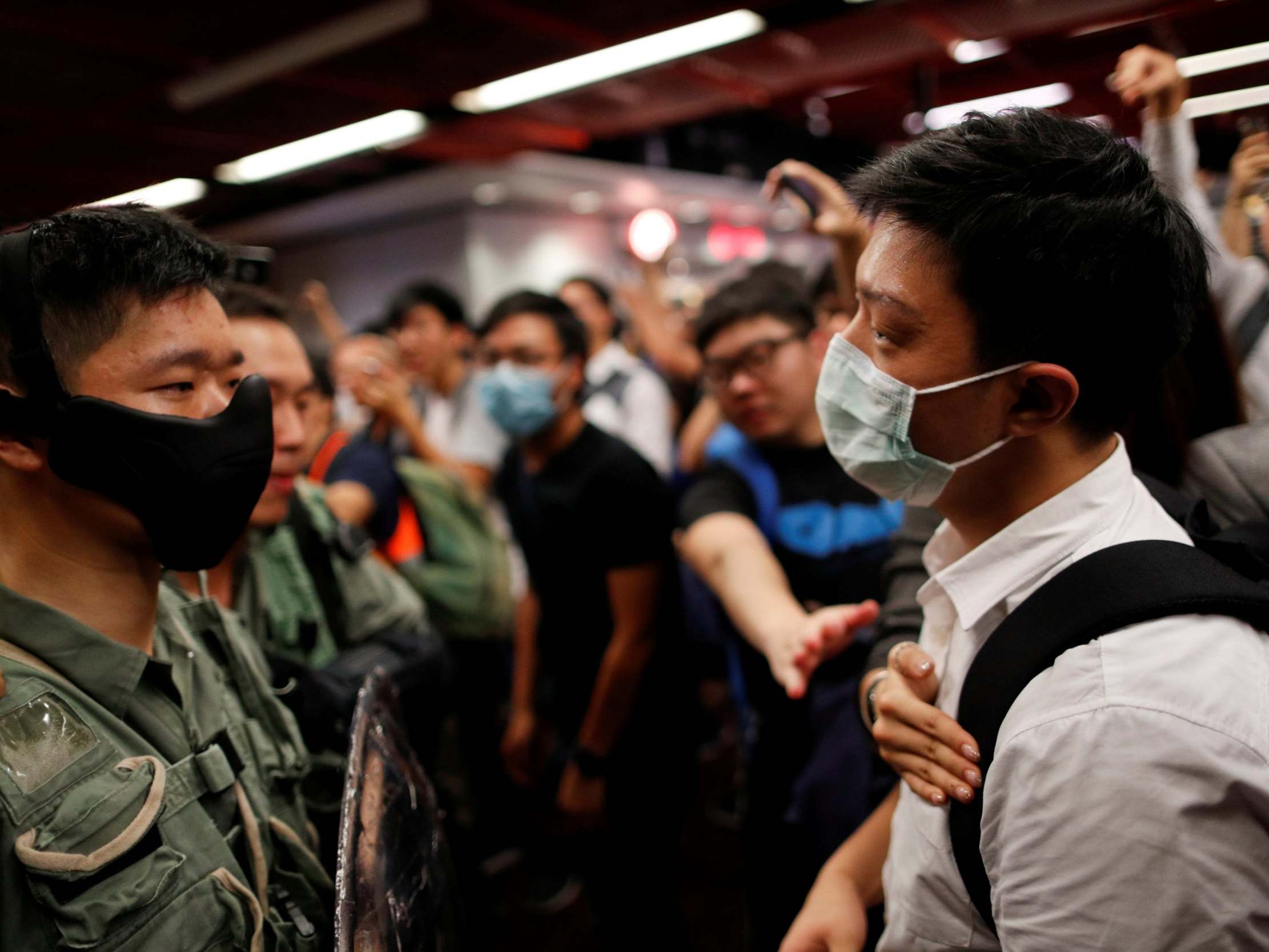 Hong Kong leader 'mulls ban on face masks' amid protests