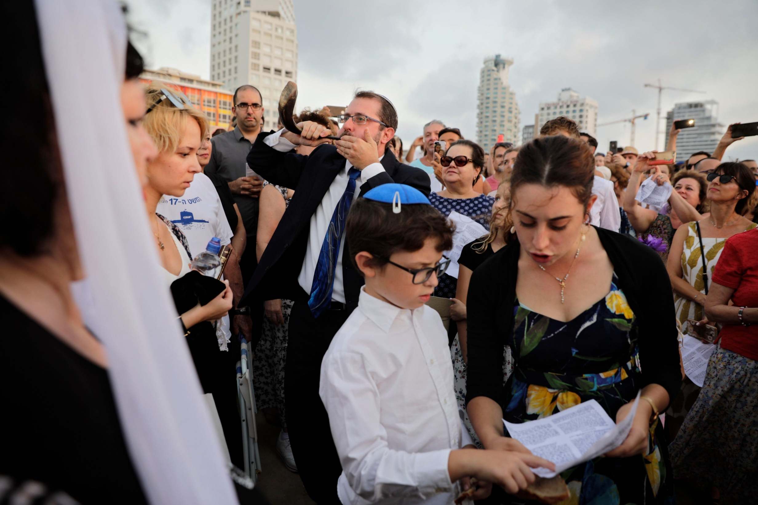 Religious Israelis participate in Tashlich, where Jews go to a beach and ‘throw away’ their sins by throwing a piece of bread into the water, in Tel Aviv last week