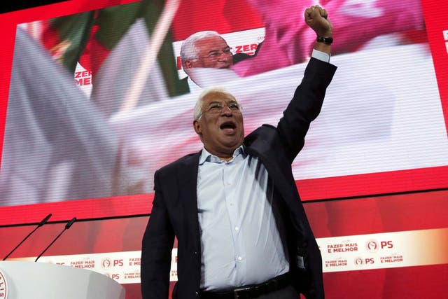 Portuguese Prime Minister and Socialist Party leader Antonio Costa raises his fist during a campaign rally in Lisbon