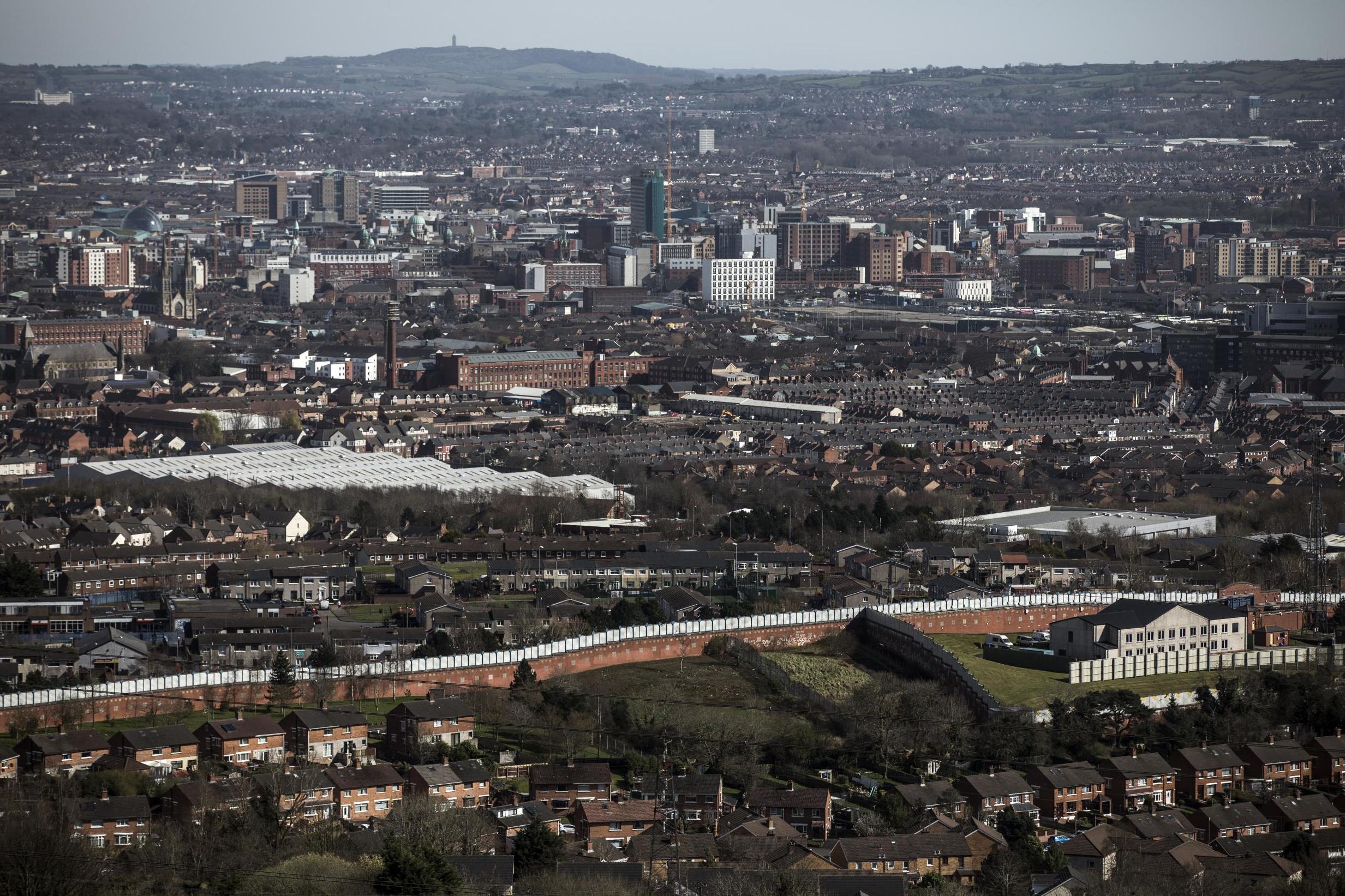 Originally built as temporary structures following civil unrest in 1969, the ‘peace walls’ dividing Catholics and Protestant communities in Belfast have become wider, longer, more numerous and more permanent (Getty)