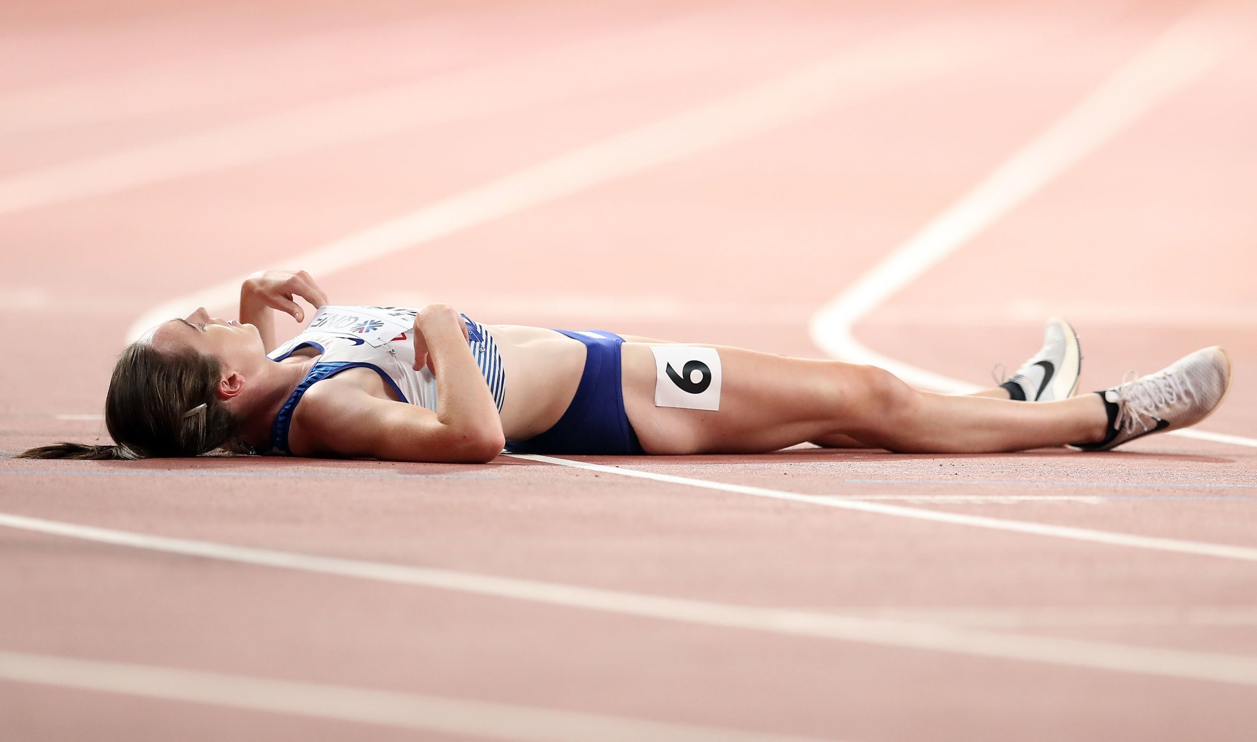 Muir lays on the track after coming up short