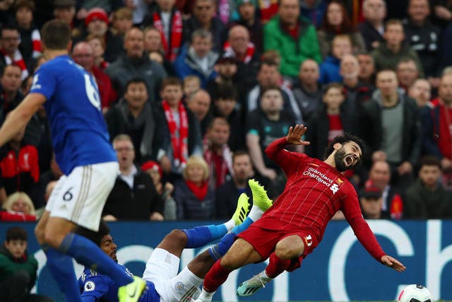 Leicester City's Hamza Choudhury tackles Liverpool's Mohamed Salah