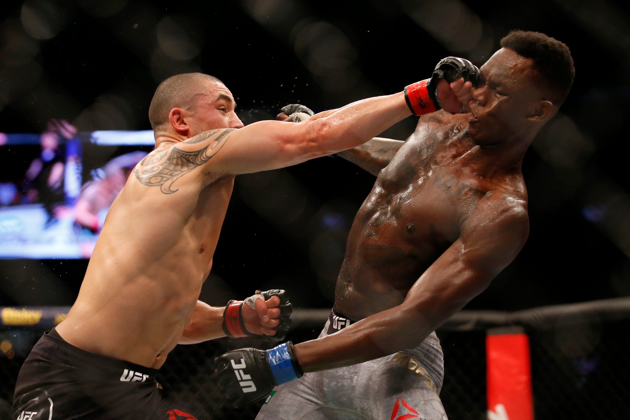 Robert Whittaker (left) is seeking to bounce back after losing his belt to Israel Adesanya