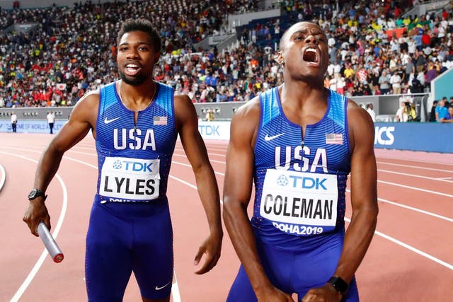Noah Lyles, left, and Christian Coleman celebrate their gold medal