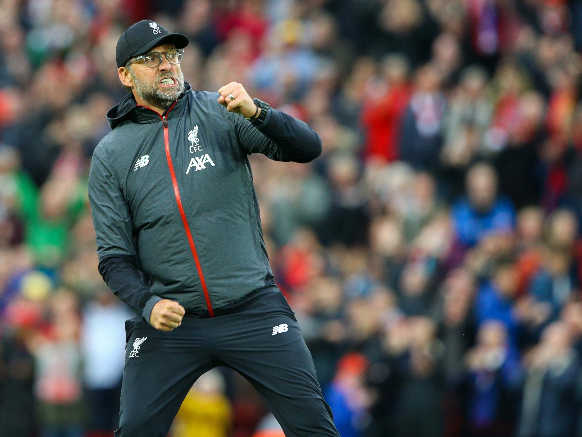 Jurgen Klopp celebrates in front of the Kop after defeating Leicester