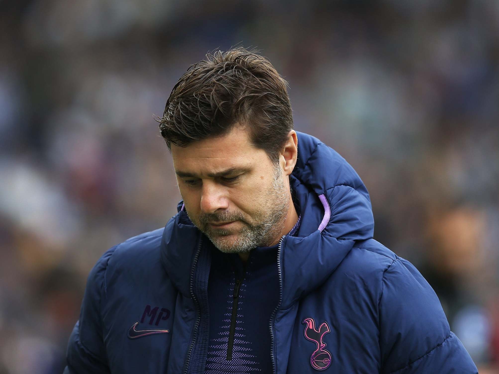 Mauricio Pochettino cuts a dejected figure during defeat against Brighton