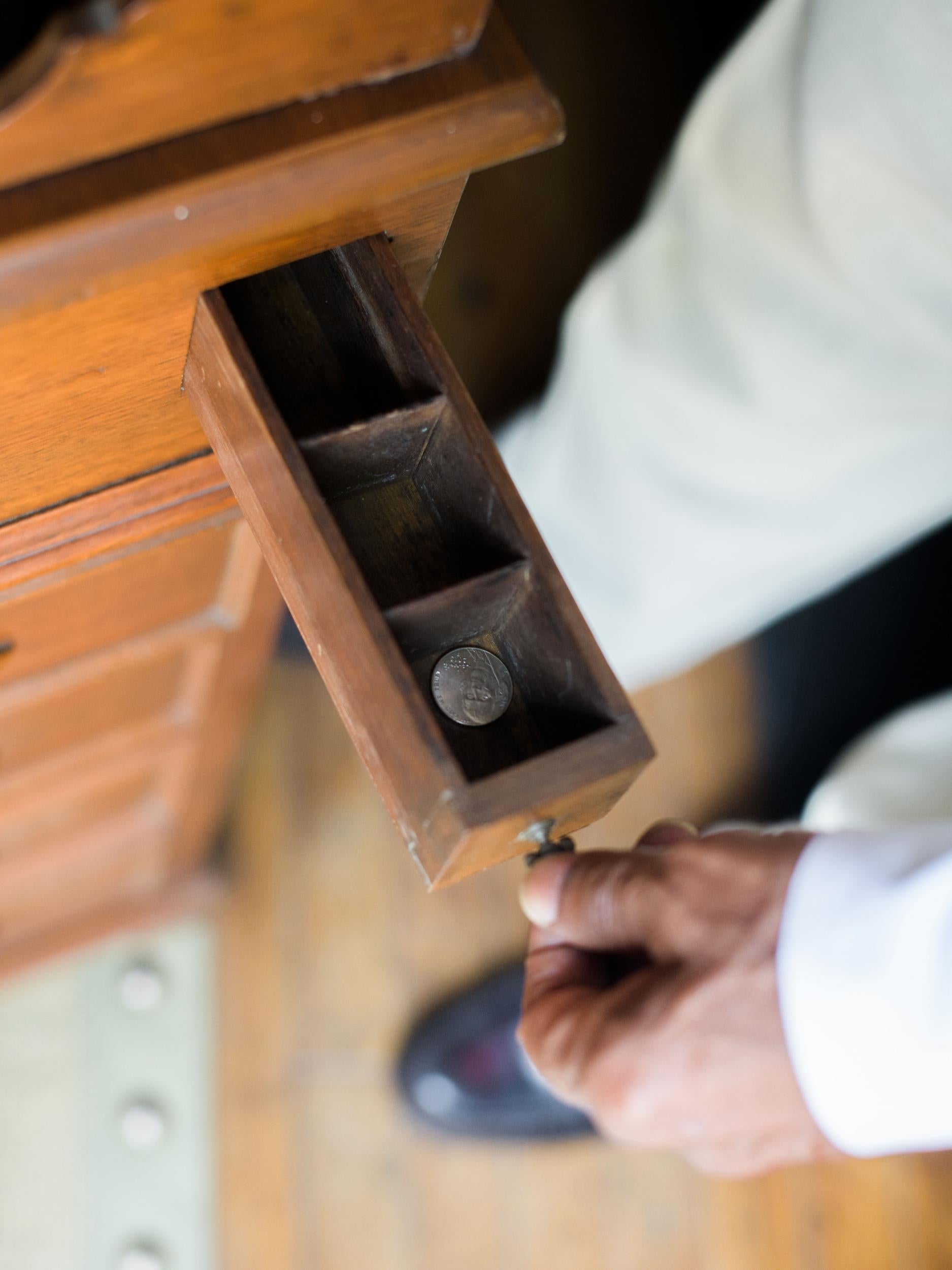 The tiny drawer in the captain’s desk used to hold rolls of nickels, which were handed out?for lunch money