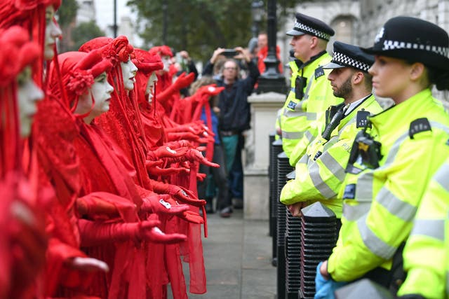 Extinction Rebellion protesters face off against police in London