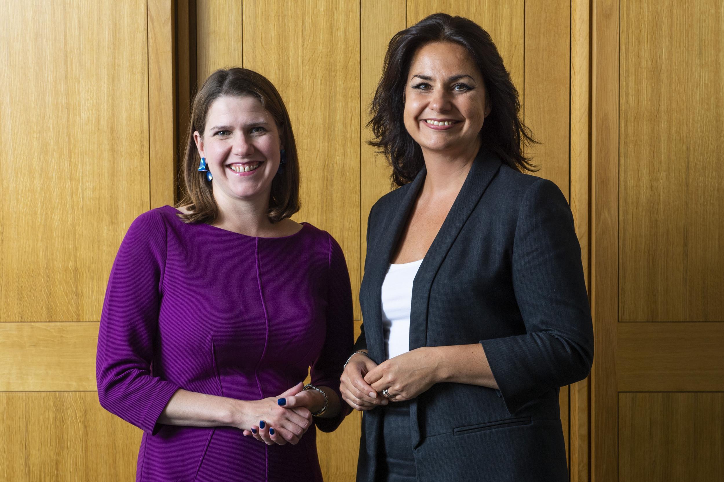 Jo Swinson stands with her latest recruit on Monday