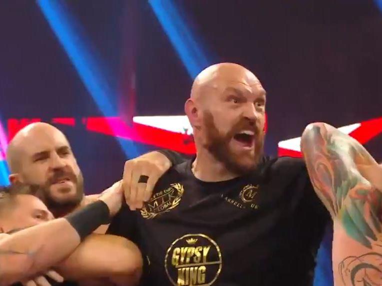 Tyson Fury is held back from Braun Strowman