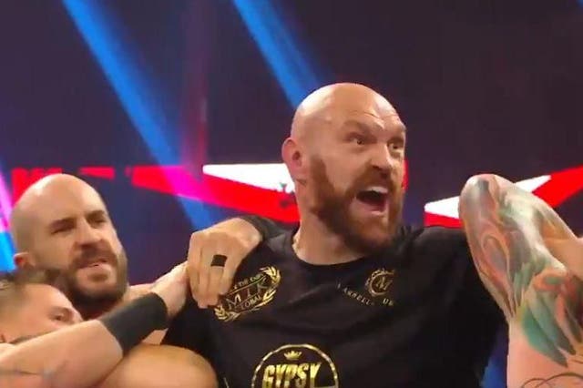 Tyson Fury is held back from Braun Strowman
