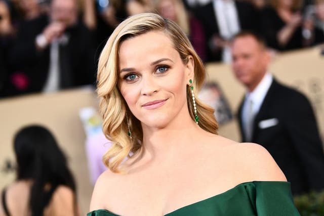Reese Witherspoon opened up about what it was like balancing work and motherhood as a young mom in Hollywood