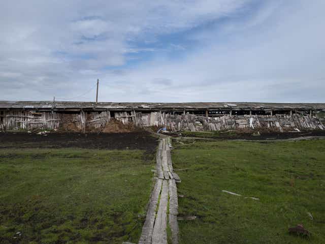 A building at a stockyard near Zyryanka illustrates the effects of the shifting ground