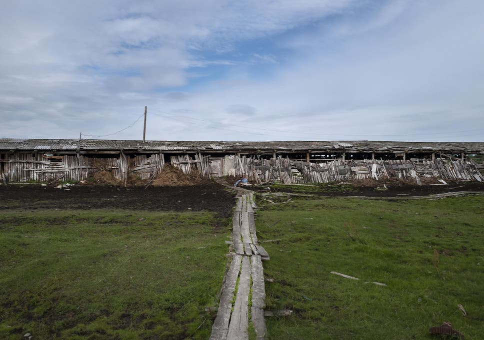 A building at a stockyard near Zyryanka illustrates the effects of the shifting ground