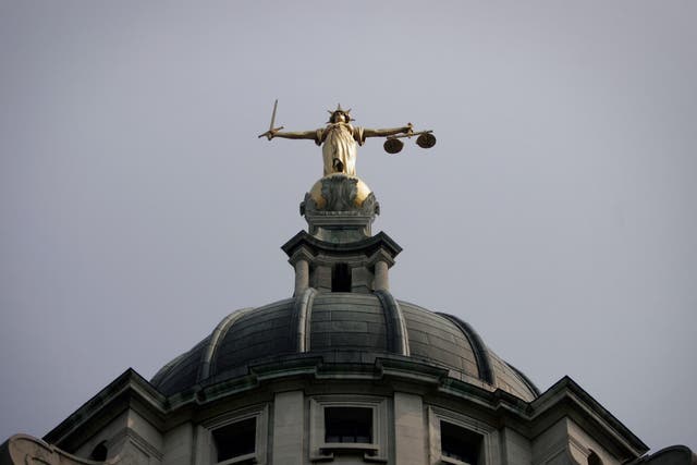 General view of the scales of justice on top of the Old Bailey, in London.