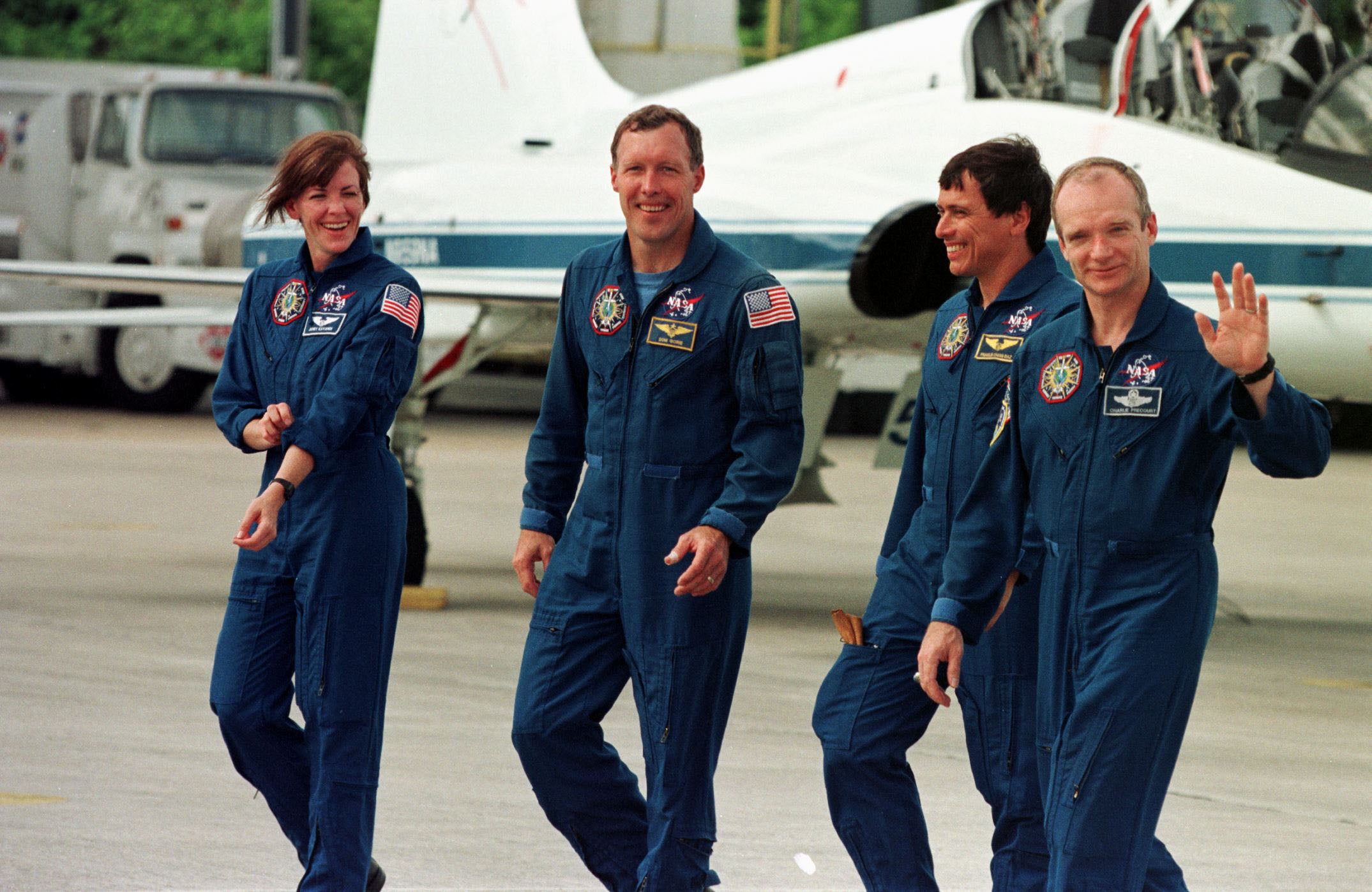 Crew of the space shuttle Discovery (with Janet Kavandi on left) walk away from a shuttle training aircraft at the Kennedy Space Centre
