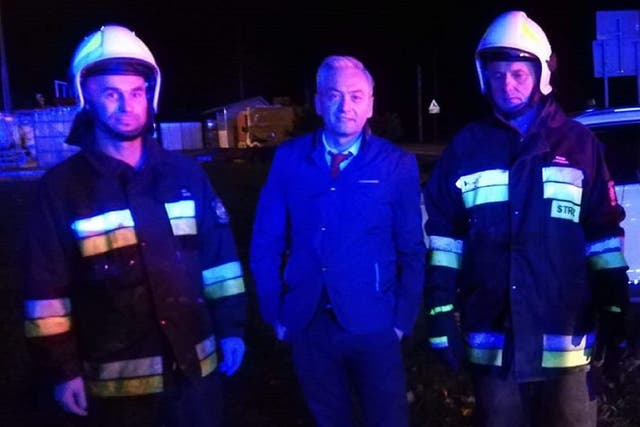 Polish politician Robert Biedron rescued a two-year-old boy and his father from a burning car after a crash in Tabor, near Warsaw, before local firefighters turned up, 7 October 2019.