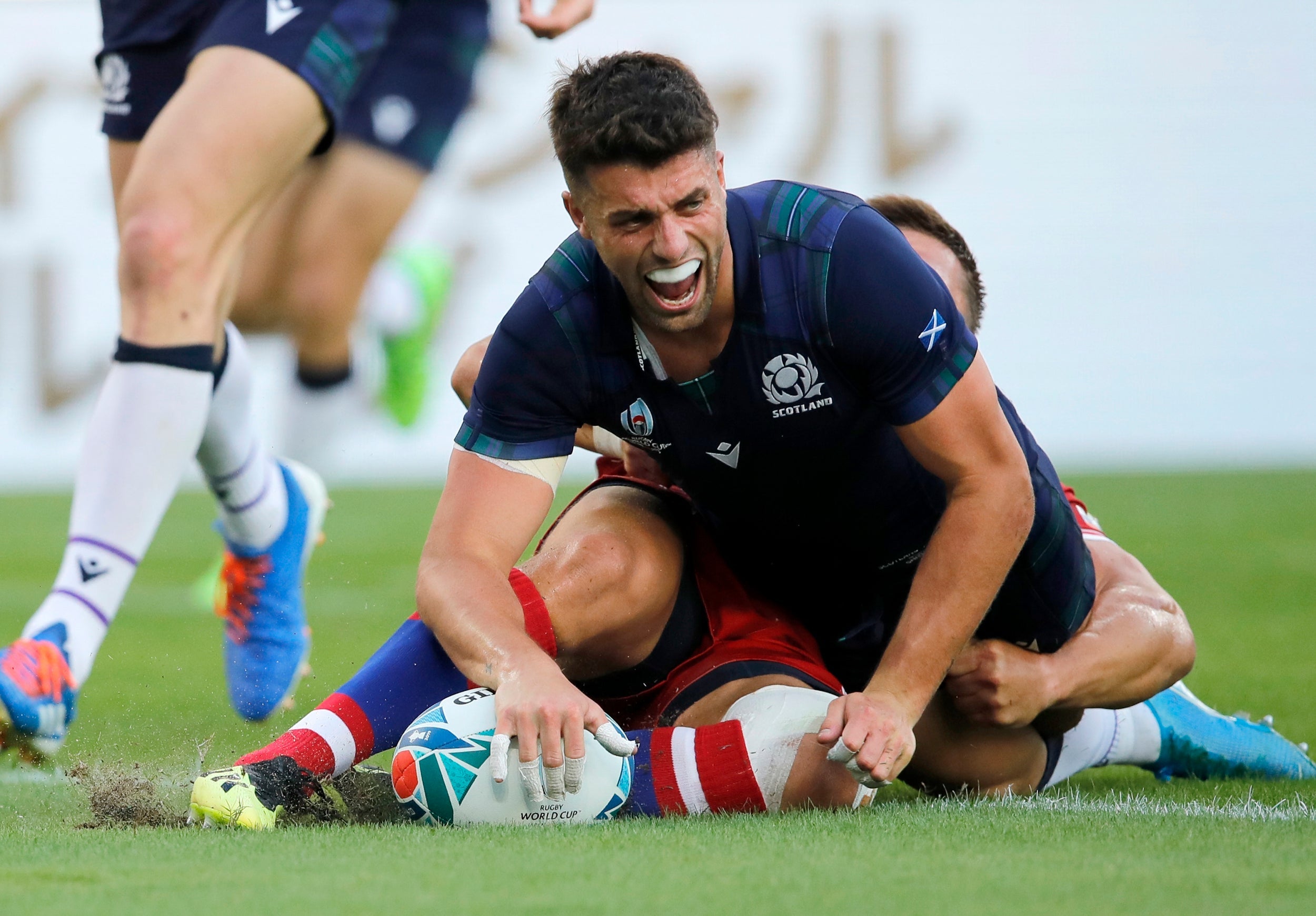 Scotland’s Adam Hastings reacts after scoring a try