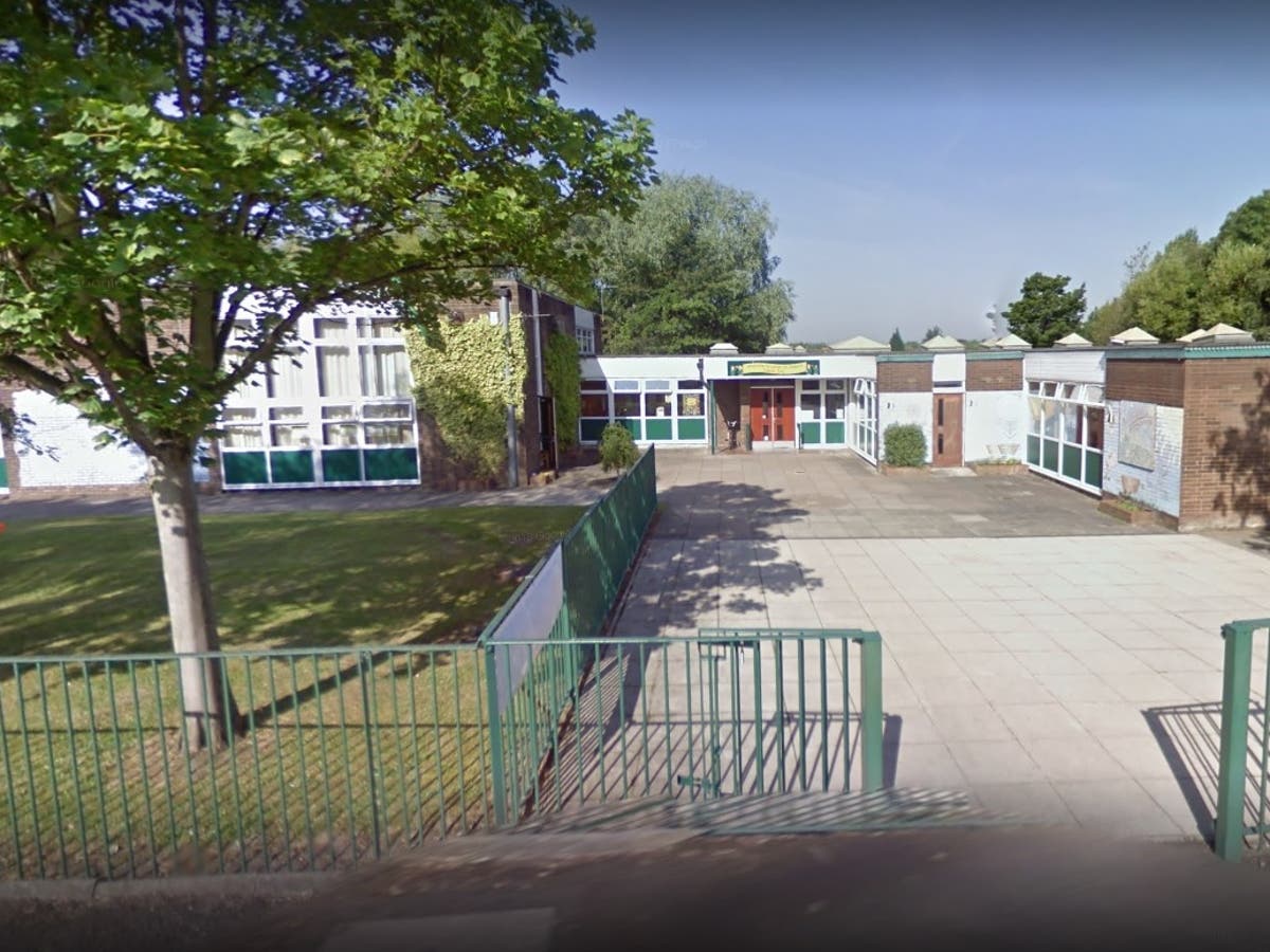 School bans parents from using phones in playground to stop them ignoring their children The